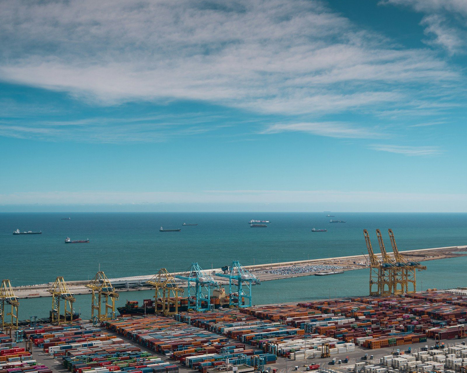 Aerial view of a busy container port at China's North — ships, cranes and stacked containers