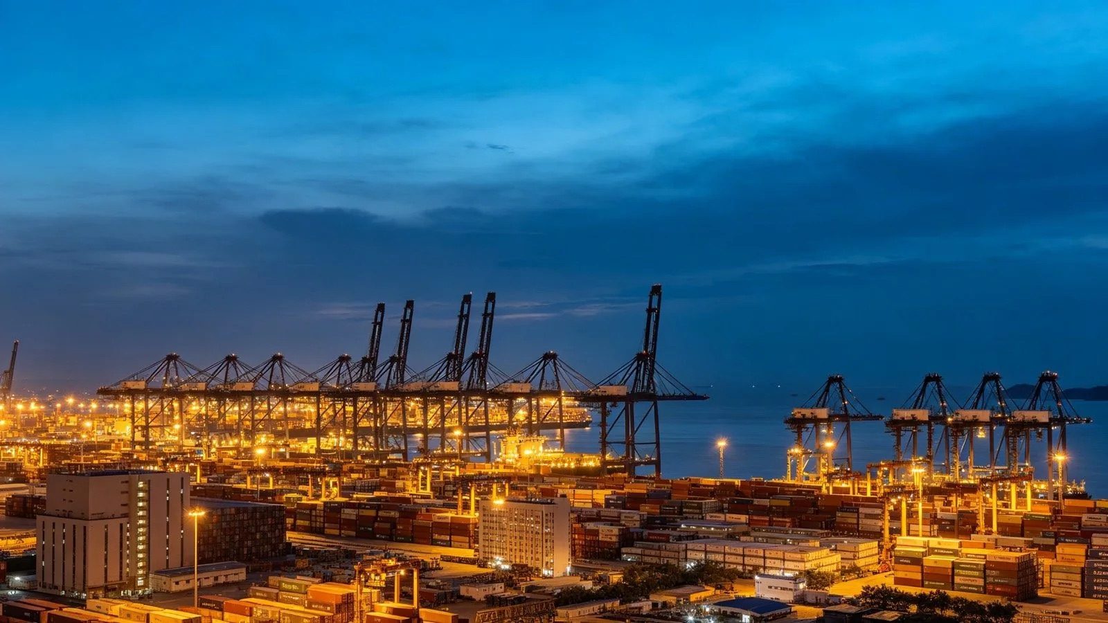 Tianjin port at dusk with container cranes